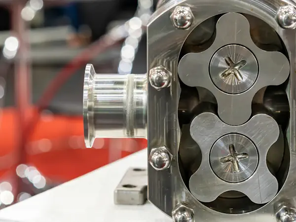 Vacuum pump with vacuum-tight, TIG-welded KF connection piece.
